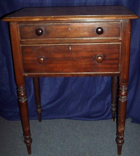 Appraisal: A Victorian mahogany side table fitted two drawers on turned