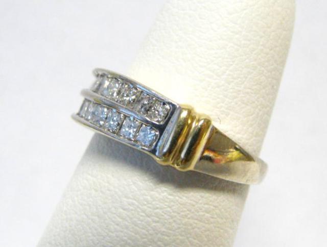 Appraisal: Lady's K two-tone gold diamond ring with approximately channel-set rectangular-cut