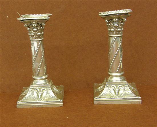 Appraisal: Pair of Victorian silver Corinthian column candlesticks London loaded h