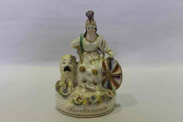 Appraisal: A STAFFORDSHIRE PORCELAIN MODEL OF BRITANNIA on an oval base