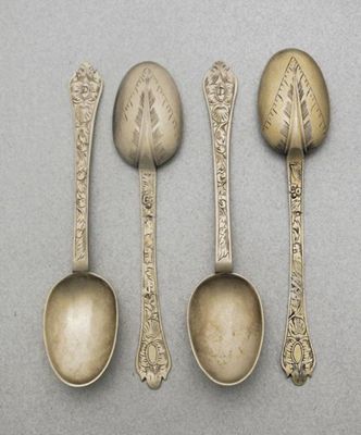 Appraisal: A set of four William III engraved silvergilt trefid teaspoons