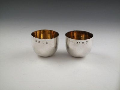 Appraisal: A pair of George II silver tumbler cups by Thomas