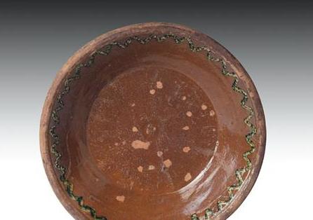 Appraisal: PENNSYLVANIA SLIP-DECORATED GLAZED REDWARE DEEP DISH MID-NINETEENTH CENTURY With rolled