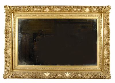 Appraisal: A rectangular wall mirror the th century leaf carved giltwood