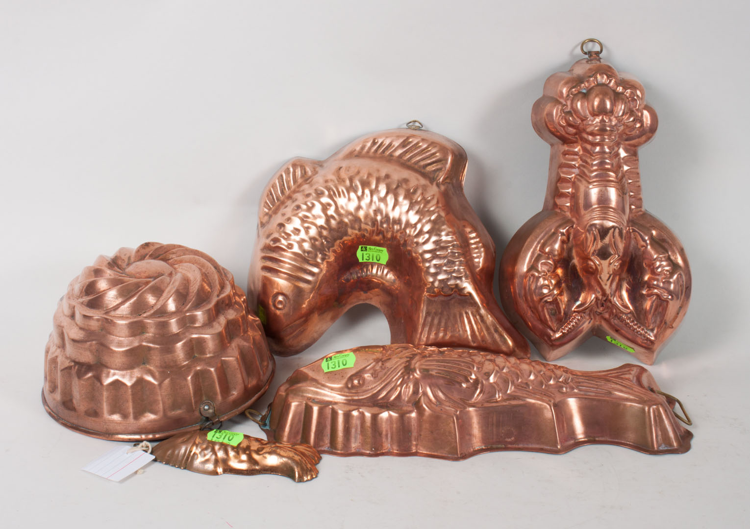 Appraisal: Nine French copper ware food molds includes five fish two