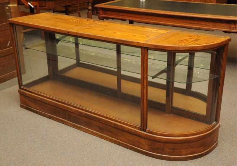 Appraisal: Oak Display Cabinet with Glass Top With one carved side