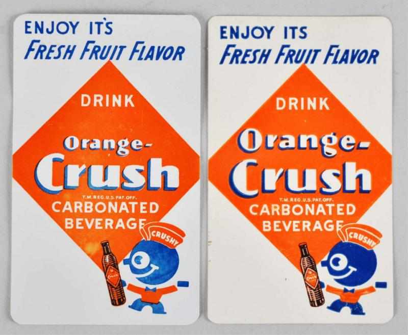 Appraisal: Orange Crush Pocket Calendars Description Both feature Crushy and are