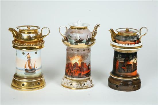 Appraisal: THREE PORCELAIN INDIVIDUAL TEAPOTS WITH WARMING BASES All have hand