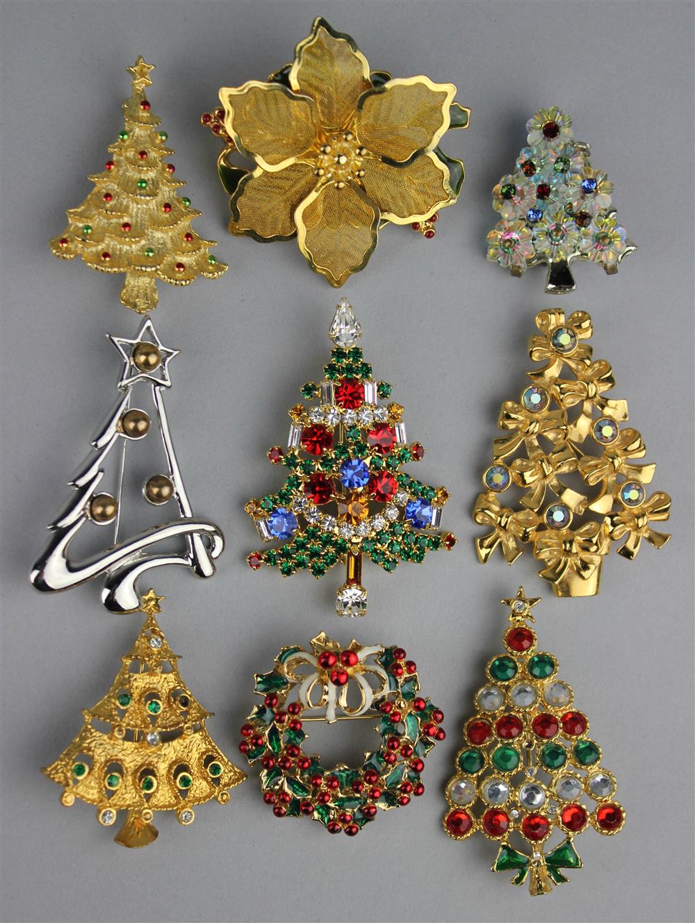 Appraisal: CHRISTMAS PIN COLLECTION DANECRAFT CHRISTMAS TREE PIN KC POINSETTIA PIN