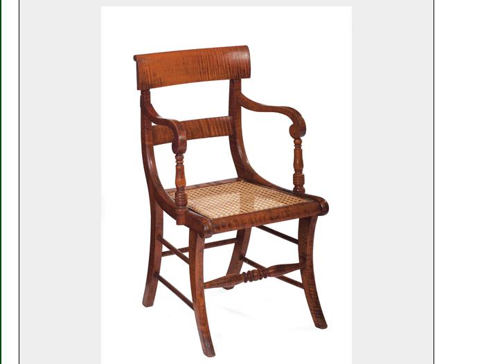 Appraisal: TIGER MAPLE ARMCHAIR WITH CANE SEAT RAISED ON SABRE LEGS