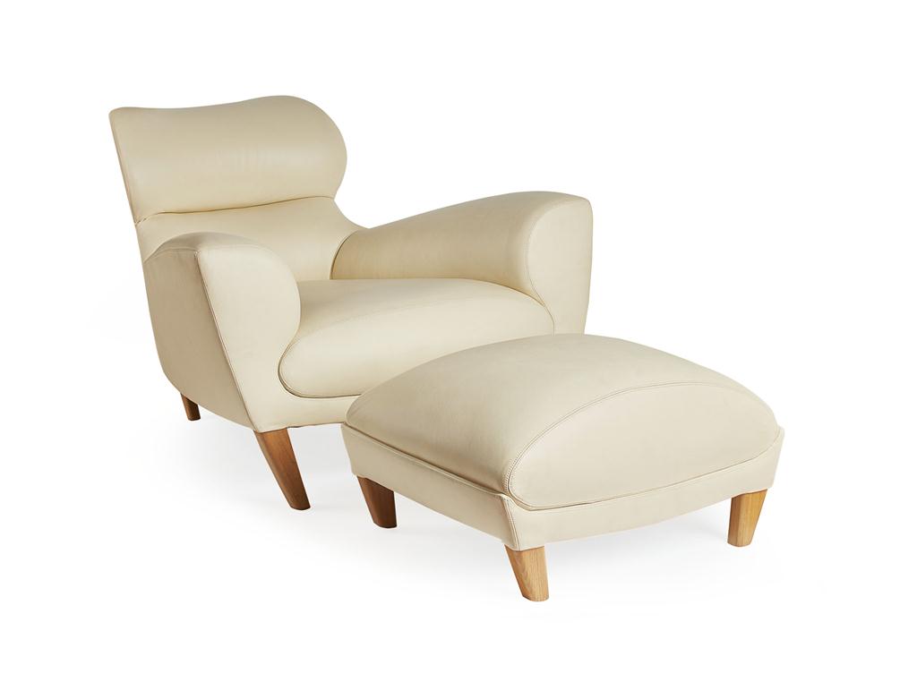 Appraisal: DAVID LINLEY FURNITURE 'ASTON' LEATHER ARMCHAIR AND MATCHING FOOTSTOOL cream