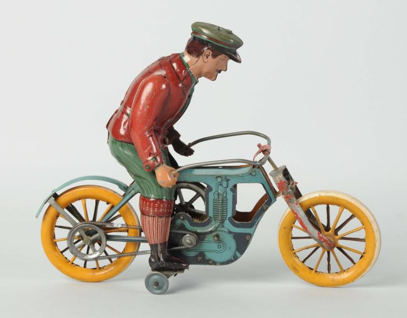 Appraisal: Scarce German Tin Litho Flywheel Motorcycle Beautiful oversized figure Marked