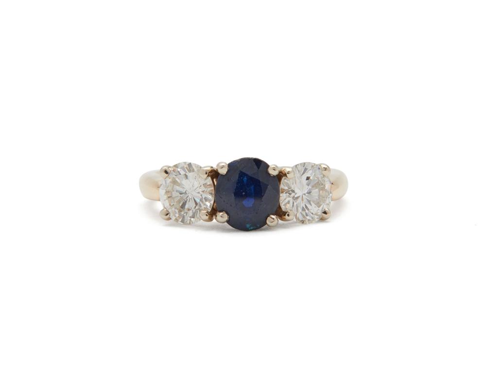 Appraisal: K Gold Sapphire and Diamond Ring centering an oval-cut sapphire