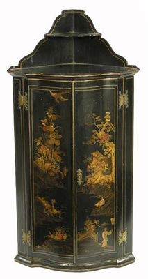 Appraisal: A Japanned serpentine front hanging corner cupboard the raised shelf