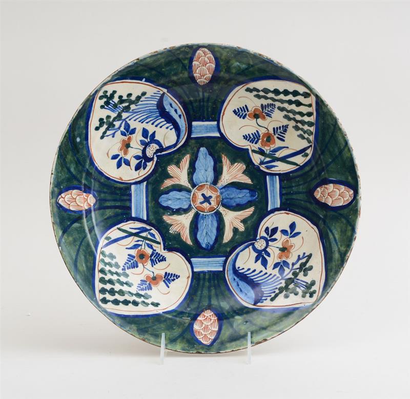 Appraisal: DUTCH POLYCHROME DELFT CHARGER IN THE GREEN HEART PATTERN Centered