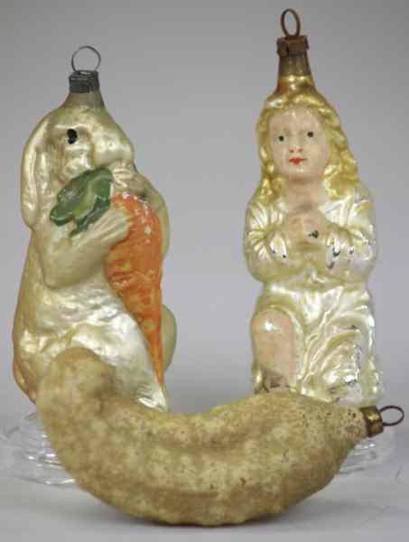 Appraisal: THREE GLASS CHRISTMAS TREE ORNAMENTS Germany includes kneeling Madonna in