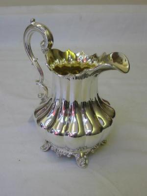 Appraisal: A WILLIAM IV JUG of lobed baluster form with moulded