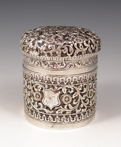 Appraisal: SILVER REPOUSSE COVERED CANISTER Fine silver with intricate repousse floral