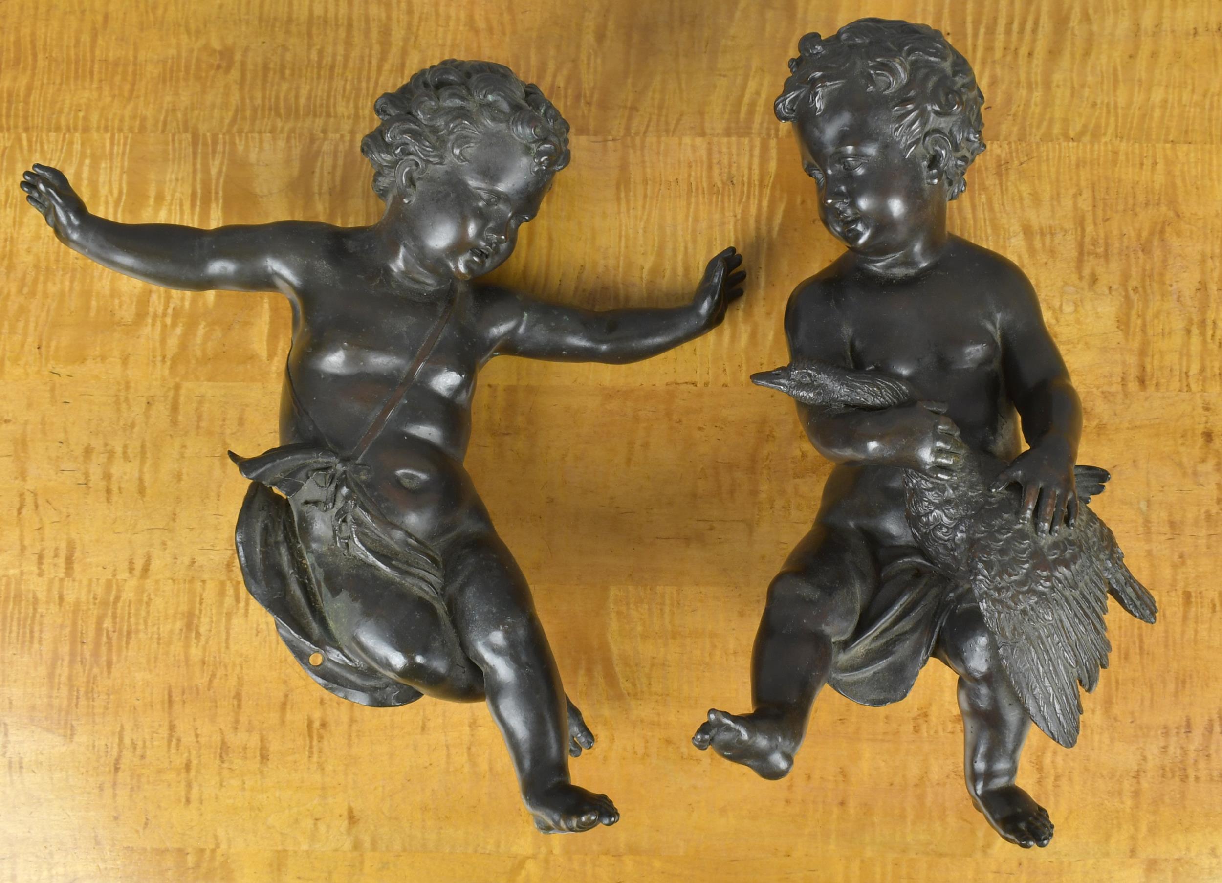 Appraisal: TWO TH C BRONZE CHERUB ORNAMENTS Two full bodied th