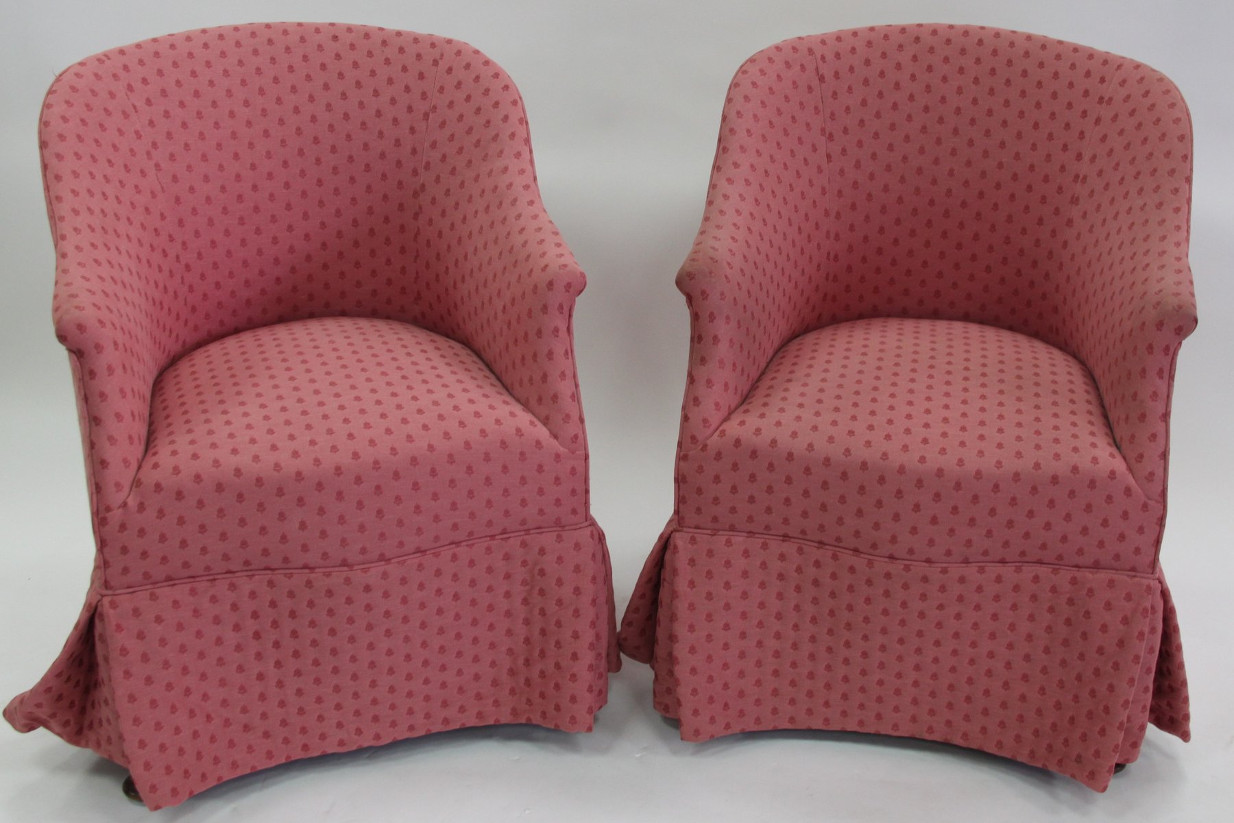 Appraisal: A pair of upholstered tub armchairs on cabriole legs with