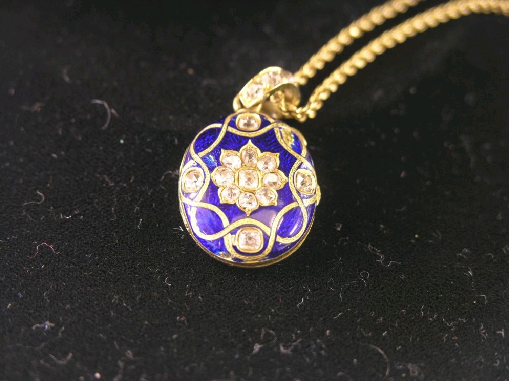 Appraisal: A Victorian gold diamond and blue enamel pendant locket on