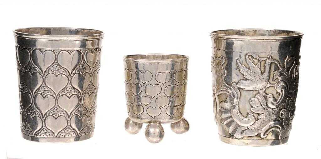 Appraisal: THREE RUSSIAN BEAKERS one repouss with a bird and rocaille