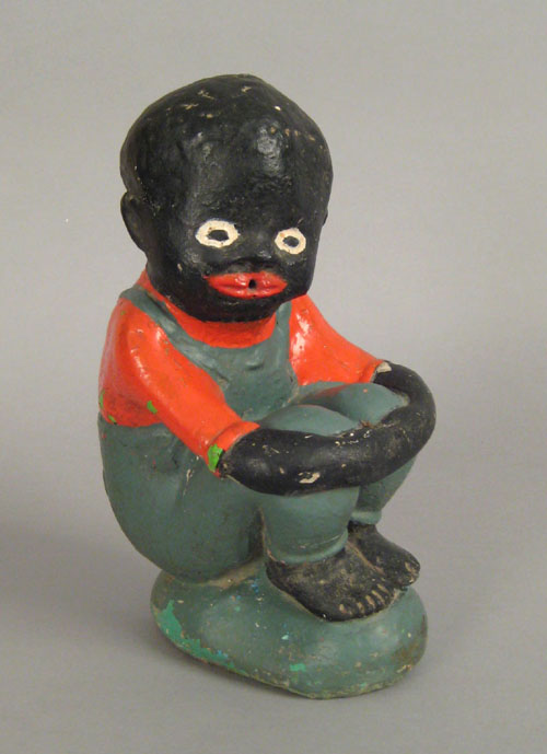 Appraisal: Painted cement statue of an African American boy h