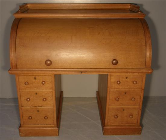 Appraisal: Maple and Co th century oak cylinder front desk the