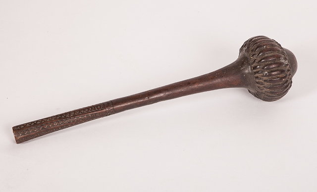 Appraisal: A FIJIAN CARVED WOODEN PINEAPPLE CLUB with tapering shaft and