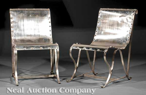 Appraisal: A Pair of Polished Steel Sling Chairs scrolled back riveted