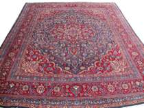 Appraisal: Meshad Carpet Meshad area rug features a ruby red field