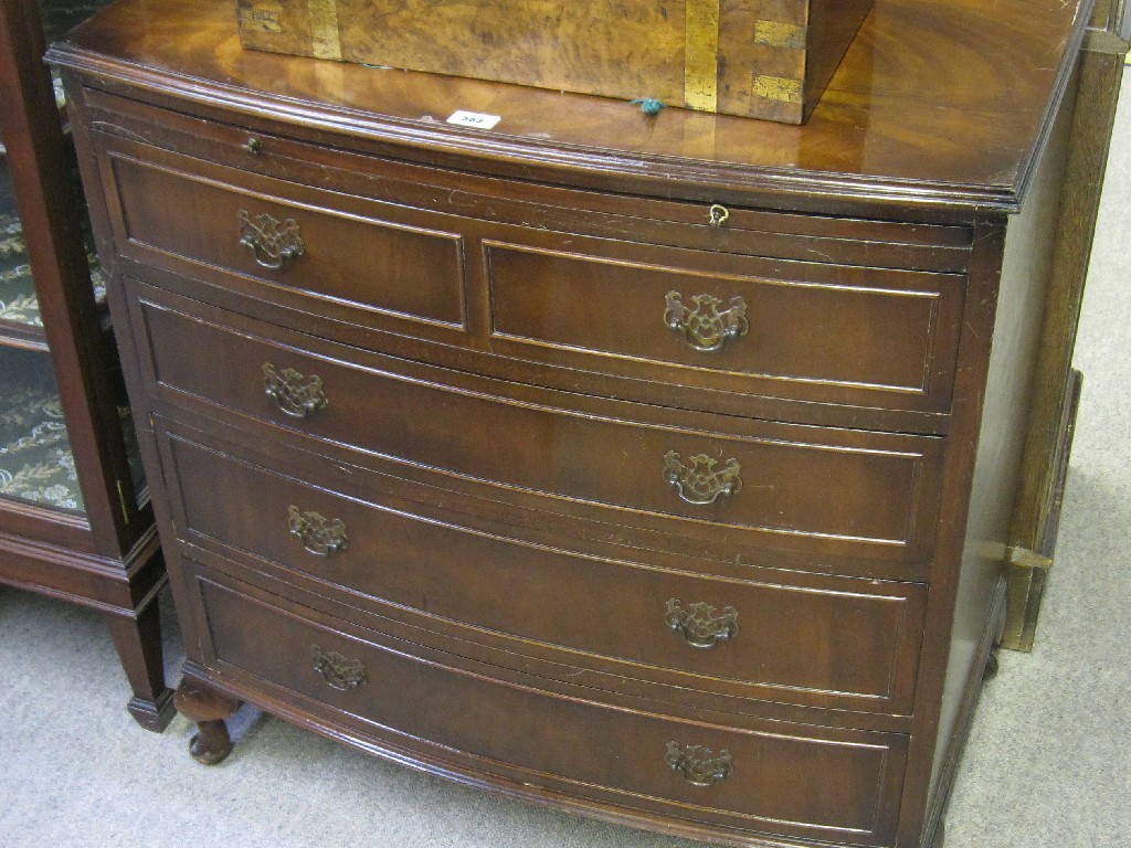 Appraisal: Mahogany bow fronted four drawer chest with brushing slide