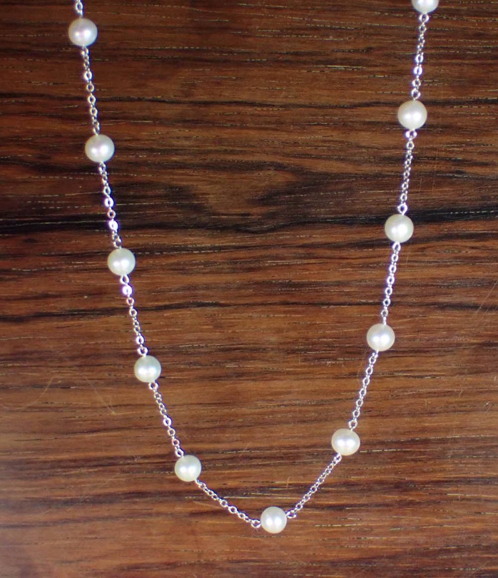 Appraisal: PEARL AND KARAT WHITE GOLD NECKLACE having white pearls spaced