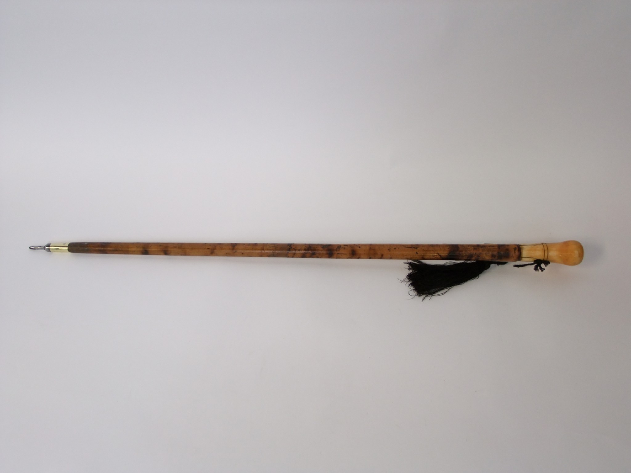 Appraisal: An antique Malacca walking cane terminating an applied worked and