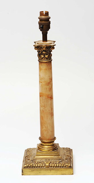 Appraisal: A WHITE MARBLE AND EMBOSSED BRASS TABLE LAMP of classical