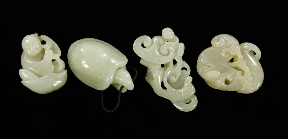 Appraisal: - Chinese Jade Pendants Lot of four Chinese pendants carved