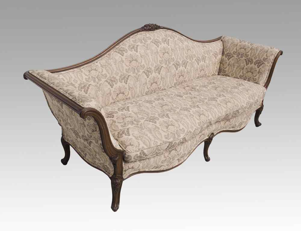 Appraisal: CARVED VICTORIAN SOFA Carved frame and feet with foliate scroll