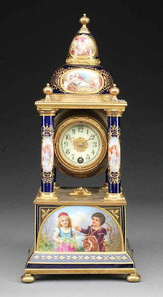 Appraisal: A Vienna style porcelain and gilt bronze mounted mantel timepiece