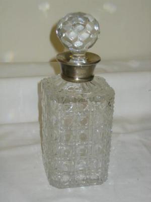 Appraisal: A CUT GLASS DECANTER of square form with flared moulded