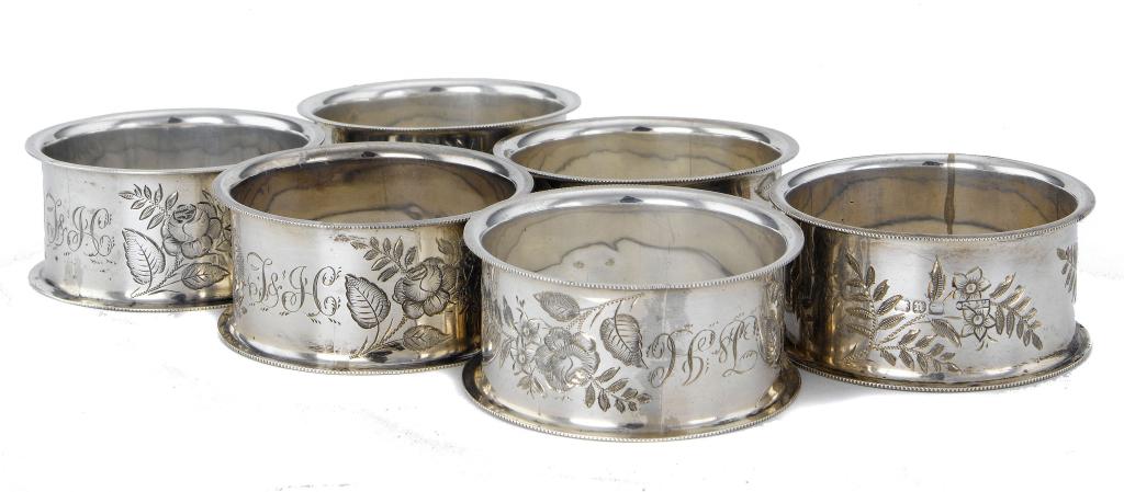 Appraisal: A SET OF SIX VICTORIAN NAPKIN RINGS engraved with roses