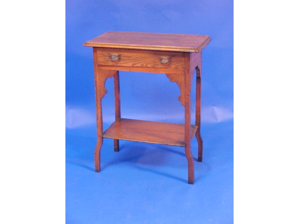 Appraisal: An Edwardian oak hall table with rounded moulded top single