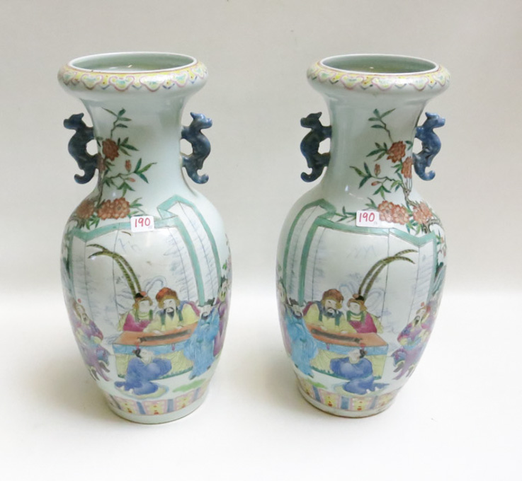 Appraisal: A PAIR OF CHINESE FAMILLE ROSE PORCELAIN VASES featuring palace