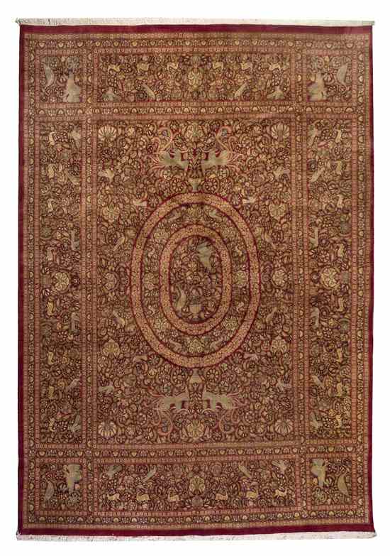 Appraisal: A Persian Wool Rug having a central oval medallion on