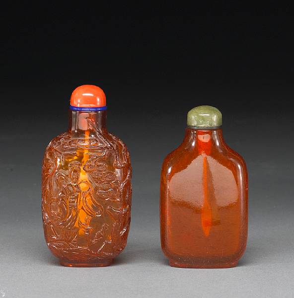 Appraisal: Two amber snuff bottles th Century Both well-hollowed the first