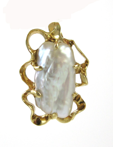 Appraisal: BAROQUE PEARL AND FOURTEEN KARAT GOLD PENDANT The yellow gold