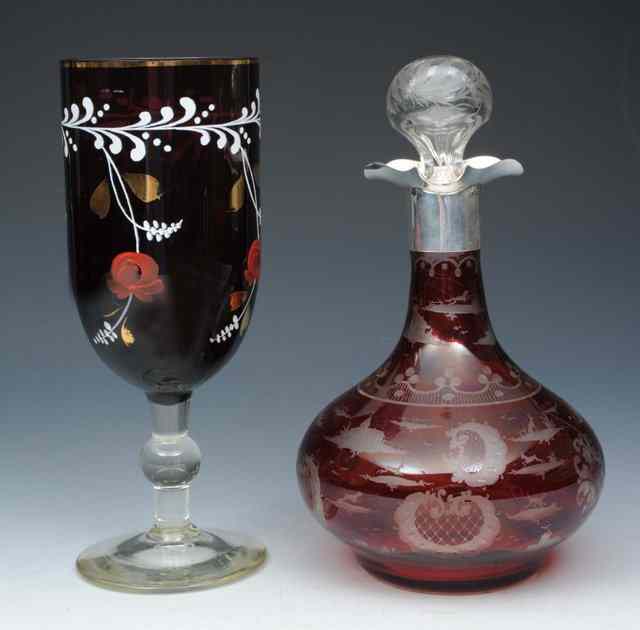 Appraisal: A RUBY GLASS DECANTER with etched stopper having a silver