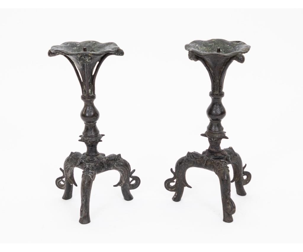 Appraisal: Pair of Chinese Ming bronze pricket sticks each supported by