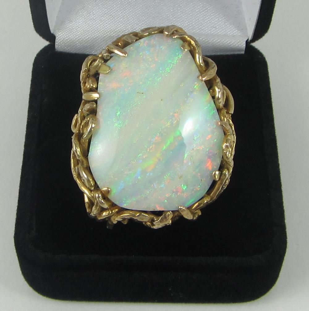 Appraisal: OPAL FOURTEEN KARAT YELLOW GOLD RING with several yellow gold