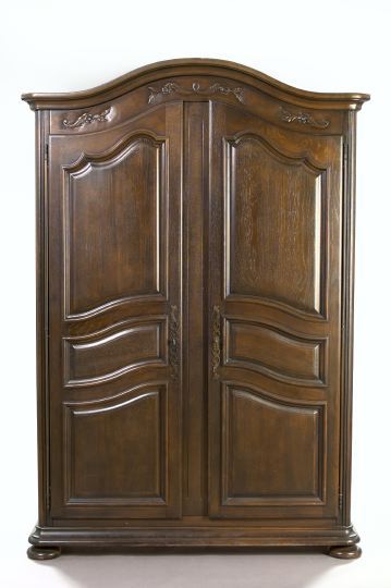 Appraisal: Provincial Louis XV-Style Oak Armoire the domed and molded cornice