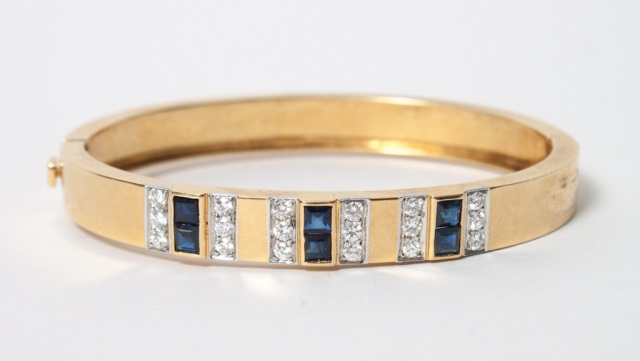 Appraisal: Lady's K diamond and sapphire bangle bracelet interior dimensions X